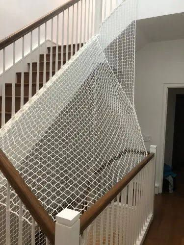 Staircase safety net over open stair landing